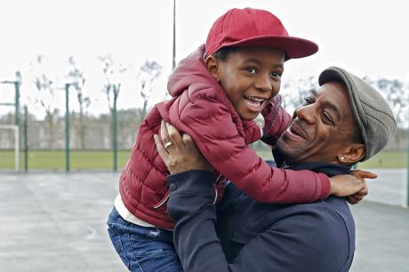 A man and child play together