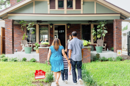 A family taking a tour of a for sale home.