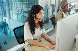photo of woman at computer on hotline