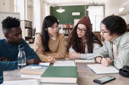Students studying around a table.