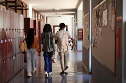 Kids walking in a school hallway