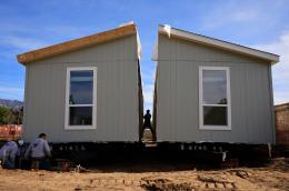 Workers constructing a manufactured home.
