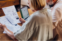 A couple looks at utility bills