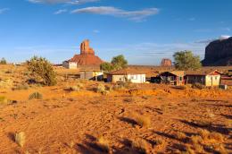 Desert homes beneath red rock buttes.