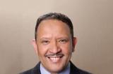 A photo of Marc Morial. Big smile, suit, dark hair.