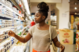young woman shops at a grocery store
